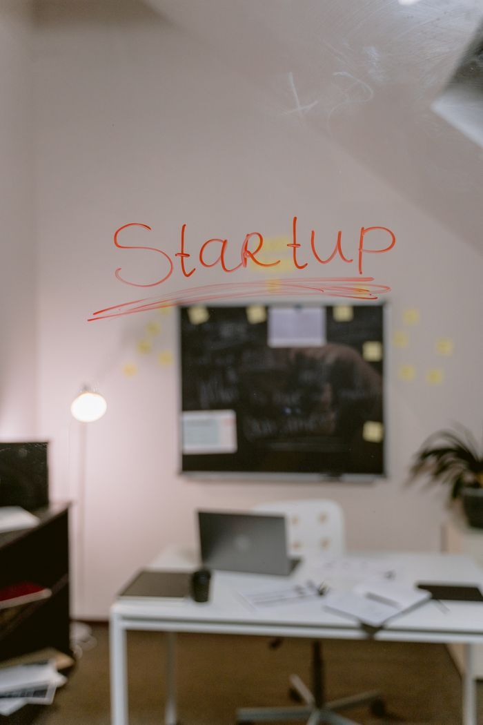 Mastering the First Impression: Your intriguing post title goes here Blurred office view with 'Startup' written on glass, highlighting creative work environment.